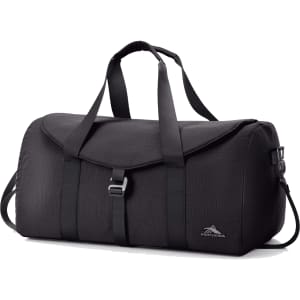 A black duffel bag with adjustable straps, a flap closure, and a logo on the side.