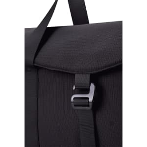 A black duffel bag with a textured finish and a clasp closure, featuring a strap for carrying.