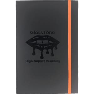 A dark grey journal with an orange elastic band and an embossed logo on the cover.