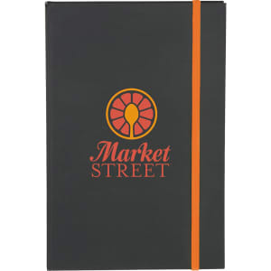 A black journal with an orange elastic band and a logo on the cover.