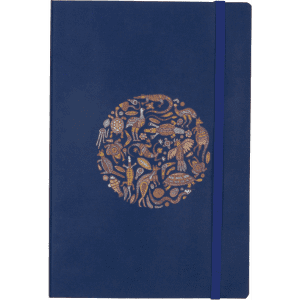 A navy blue soft bound journal featuring a decorative circle design and an elastic closure.