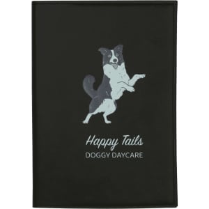 A black refillable journal with a design featuring a jumping dog and text for "Happy Tails Doggy Daycare."