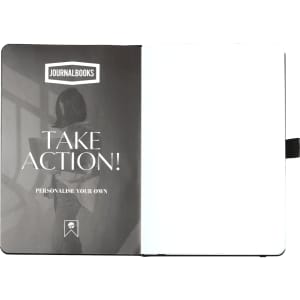 A blank, white notebook with a black cover and a logo on the inside. The front page features a motivational phrase.