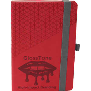A red notebook with a geometric design, featuring a grey elastic band and a logo on the front.