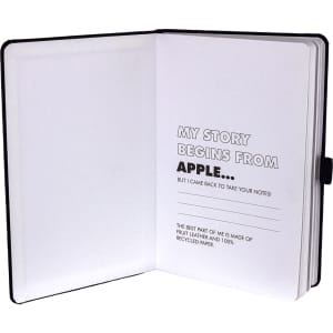 An A5 notebook with a black cover, featuring white recycled paper pages and a logo.