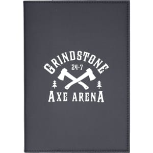 A refillable journal with a dark cover featuring a logo and graphic of crossed axes.