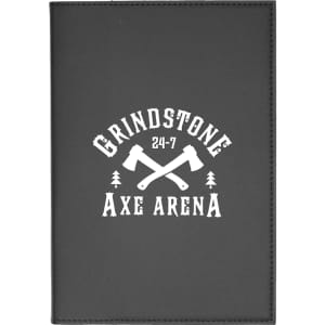 A black leather refillable journal featuring a logo with crossed axes and trees.