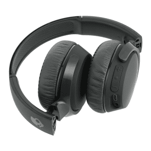 A pair of black wireless headphones with cushioned ear pads and a logo on the side. The headphones feature buttons and a charging port.