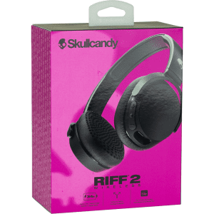 A pink box containing Skullcandy Riff Wireless headphones in black, featuring a handle and a logo.