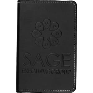 A black leather notebook with embossed branding, featuring white stitching along the edges.
