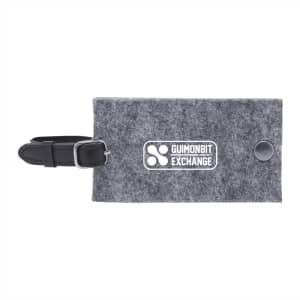 A grey recycled felt luggage tag with a black strap and a logo on the front.