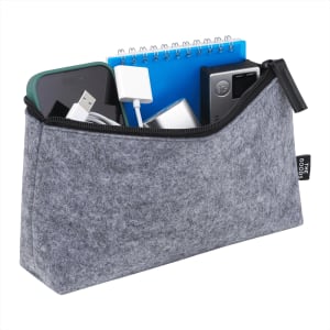A grey zippered pouch containing a phone, charger, notebook, and various small items. It has a branding logo.