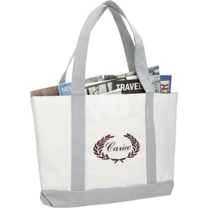 A large white tote bag with grey handles, featuring newspapers and a logo on the front.
