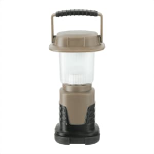 A mini camping lantern in a brown and black design, featuring a textured handle and a clear light section.