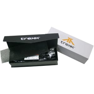A black and silver box containing a Trekk Torch with Compass, featuring a logo on the packaging.