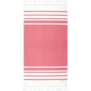 A pink and white striped beach towel with fringes and a small logo. Ideal for use on the beach or poolside.
