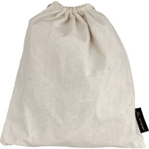 A cream-coloured drawstring bag made of fabric, featuring a small branding label on the side.