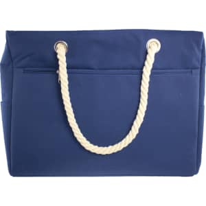 A navy waterproof beach bag with cream rope handles and side pockets, featuring a simple design.