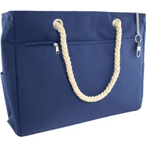 A navy waterproof beach bag with rope handles and zippered pockets. Features branding.
