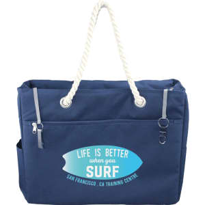 A navy blue waterproof beach bag with rope handles and a front pocket, featuring a logo on the side.