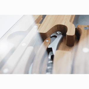 A bamboo knife set featuring various utensils and a corkscrew, presented in a sleek case with a glass lid.
