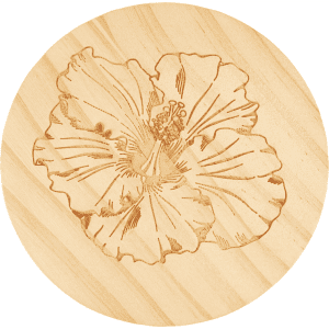 A round wooden coaster featuring an engraved hibiscus flower design. The wood has a natural finish.
