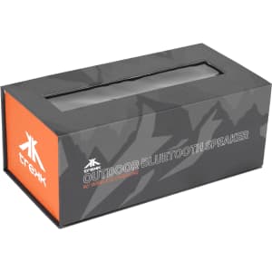 A black and orange box featuring a wireless outdoor Bluetooth speaker, decorated with a mountain pattern and a logo.