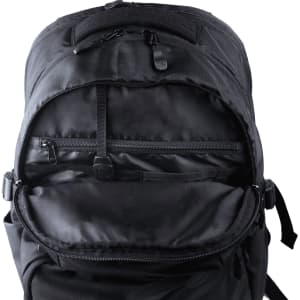 A black computer backpack with a wide opening, featuring a large compartment and a small zippered pocket inside.