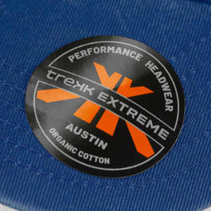 A blue organic cotton cap featuring a logo on the front.