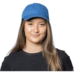 A blue organic washed cotton cap displayed on a model, featuring a logo on the front.