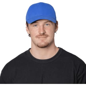 A blue organic cotton twill cap worn by a person, featuring a logo on the front. The individual is in a black shirt.