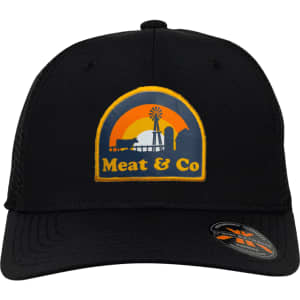 A black trucker cap featuring a logo with a sunset, windmill, and text, "Meat & Co".