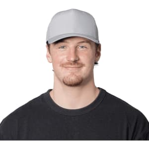 A grey trucker cap with a structured front and mesh back, worn by a smiling man in a black shirt.