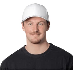 A white cap with a structured design, featuring a logo at the front, worn by a smiling man in a black t-shirt.
