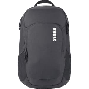 A black Thule Achiever 15 laptop backpack featuring zippered pockets and mesh side panels. It has a logo on the front.