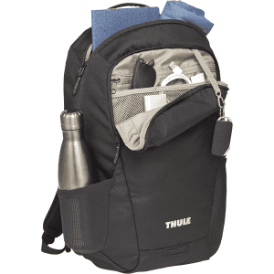A black laptop backpack with various compartments, featuring a drink bottle and carrying a few items inside.