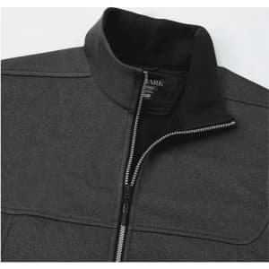 A grey softshell vest featuring a high collar and a zippered front, with a logo on the inside.