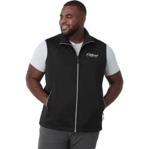 A black eco waterproof softshell vest featuring a zip front and side pockets, worn by a smiling man.