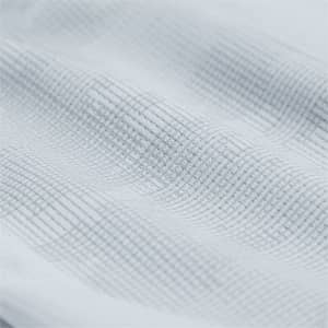 A textured close-up of fabric in a light grey hue, featuring a subtle grid pattern.