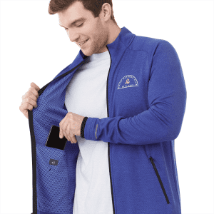 A man in a blue jacket with a zip, reaching into an inner pocket, showcasing the jacket's interior design.