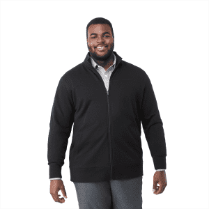 A man wearing a black eco fleece full zip jacket, smiling and standing against a white background.
