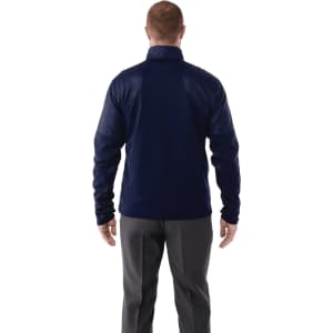 A men's navy full zip performance jacket with thumb holes, featuring a smooth exterior and fitted design.