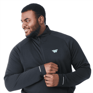 A man wearing a black quarter zip jacket with a logo on the chest, featuring long sleeves and a comfortable fit.