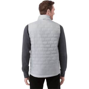 A lightweight, packable insulated puffer vest in light grey, featuring a quilted design, worn over a dark long-sleeve top.