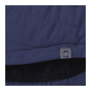 A navy insulated shacket featuring a silky exterior and a soft black lining, with a logo tag visible.