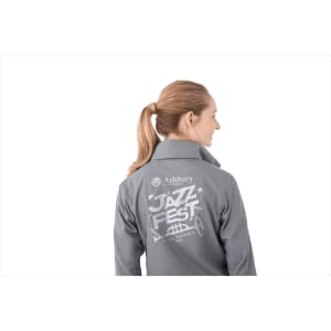 A grey women's packable rain jacket featuring a logo and graphic design on the back.