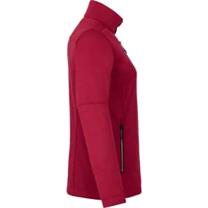 A red women's softshell jacket featuring a zippered front, side pockets, and a high collar. It has a logo.