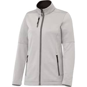 A women's softshell jacket in light grey with a zippered front and pockets. The jacket features a high collar and has a logo.