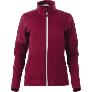 A women's full zip performance jacket in burgundy, featuring thumb holes and textured panels. Includes a logo.