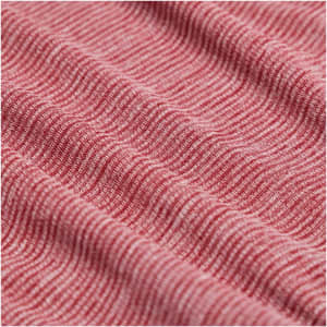 A textured, red eco-knit fabric featuring a subtle wave pattern, ideal for a performance half zip jumper.
